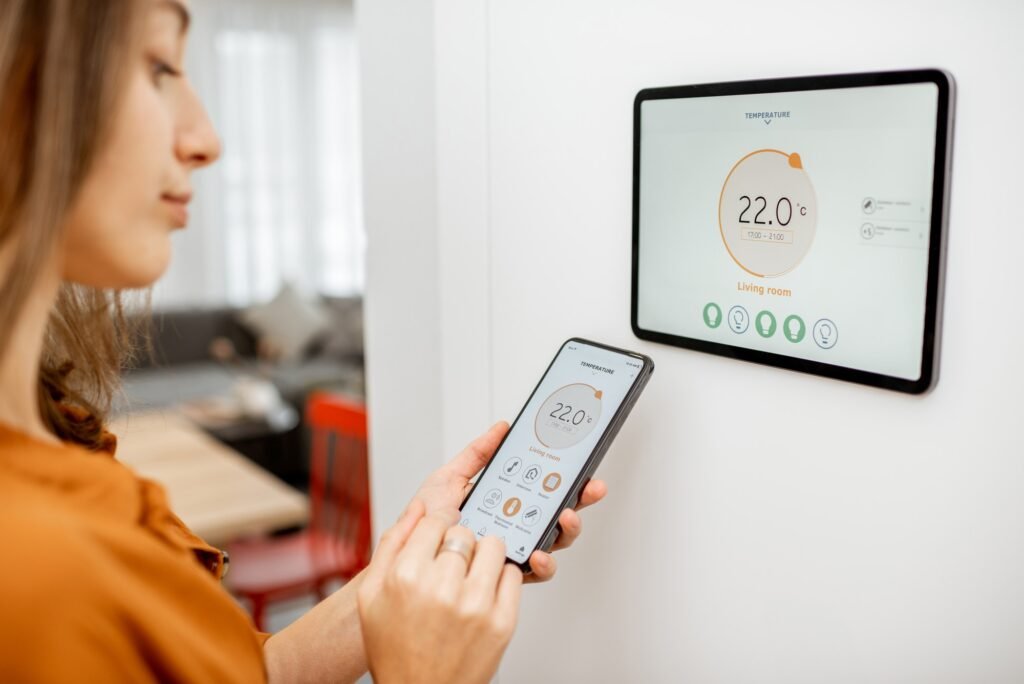 woman controlling heating with a smart devices